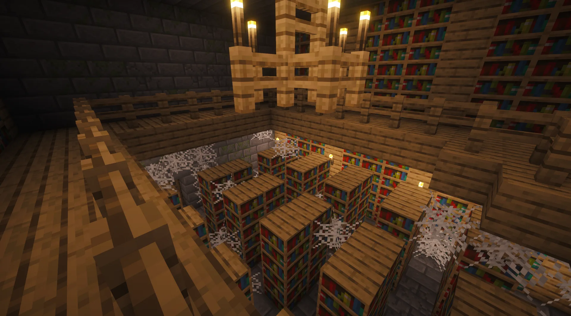 Two-storey stronghold library with bookshelves, wooden balcony, torch chandelier and cobwebs.